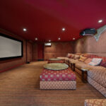 Cozy home theater with plush seating and warm lighting.