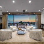 Elegant living room with ocean view and modern decor.