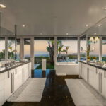 Modern outdoor kitchen with a stunning ocean view and elegant design.